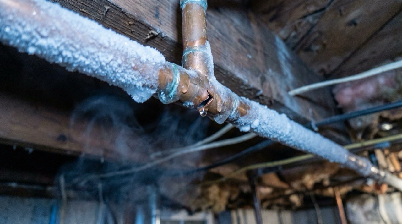 Mark Johnson & Sons Plumbing technician thawing a frozen water line in a North Louisiana home